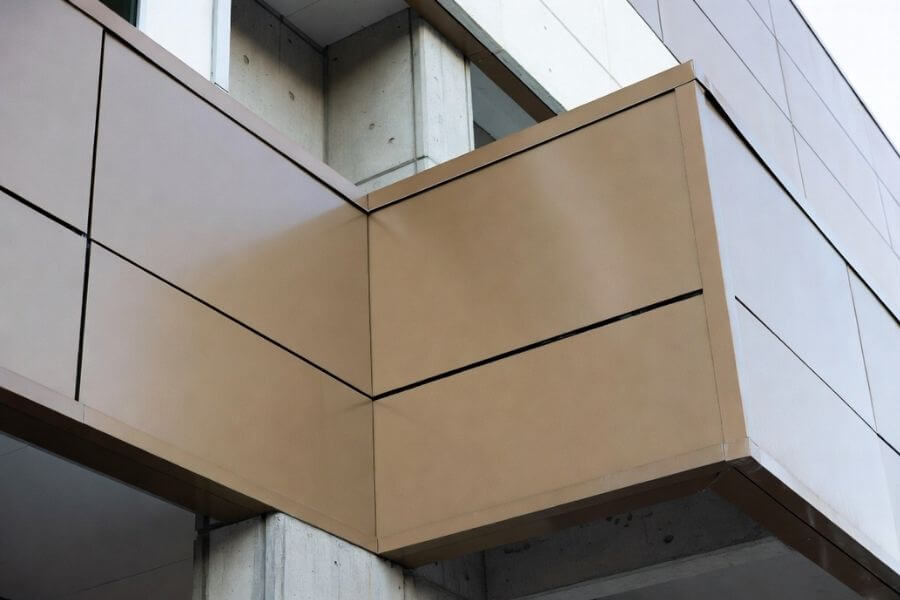 ACP facade color mismatch between panels and trim system showing color inconsistency