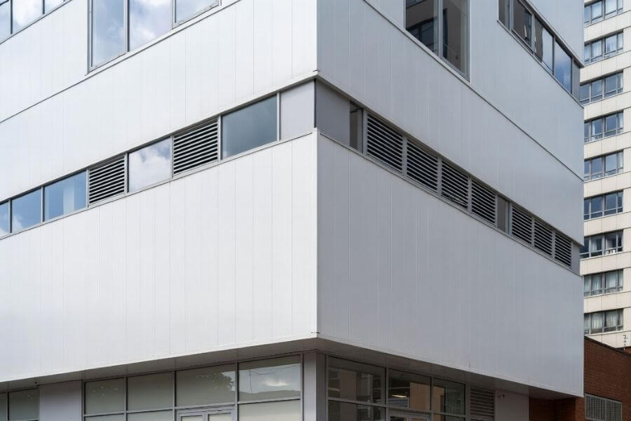 aluminum composite panel facade after graffiti removal commercial building project