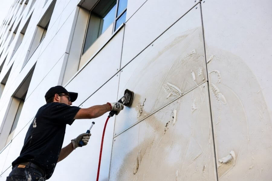 incorrect graffiti removal damaging aluminum composite panel coating